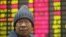 An investor sits in front of the stock price monitor at a private securities company in Shanghai, China, November 22, 2012. 