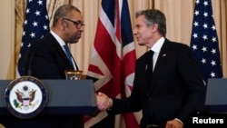 U.S. Secretary of State Antony Blinken and British Foreign Secretary James Cleverly shake hands at the end of their press conference at the State Department in Washington, Jan. 17, 2023.  