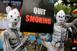Activists dress as skeletons during an awareness campaign on "World No Tobacco Day" in India, 2014. (AP Photo)