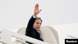 U.S. Secretary of State Antony Blinken waves as he departs to visit Israel and West Bank