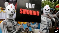 Activists dressed as skeletons participate in an awareness campaign on World No Tobacco Day in Kolkata, india, May 31, 2014.