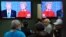 People watch the U.S. presidential debate in a restaurant in the Queens borough of New York City, Sept. 26, 2016. 