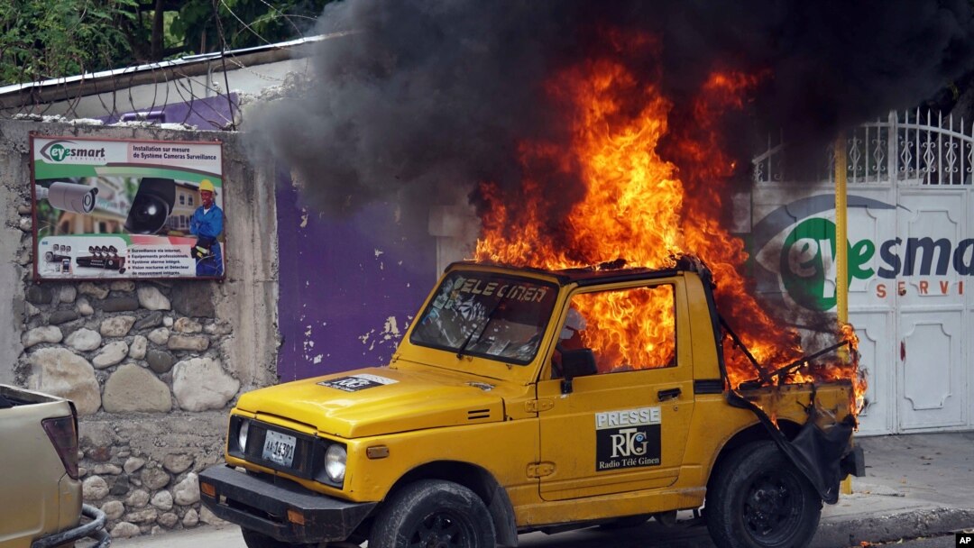Haiti Protesters Set Fire to Car 