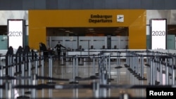 An empty airline check-in hall is seen at Guarulhos International Airport amid the outbreak of the coronavirus disease (COVID-19), in Guarulhos, near Sao Paulo, Brazil, May 25, 2020.