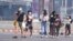 FILE - Tourists wear masks in Chiang Mai province, Thailand, April 2, 2019. The air hanging over Thailand's far north has become so polluted, the prime minister went Tuesday to see in person what's been called a severe health crisis.