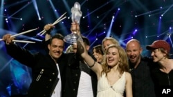 Winner of the 2013 Eurovision Song Contest Emmelie de Forest of Denmark who sang Only Teardrops, celebrates with the trophy after the final at the Malmo Arena in Malmo, Sweden, May 18, 2013.