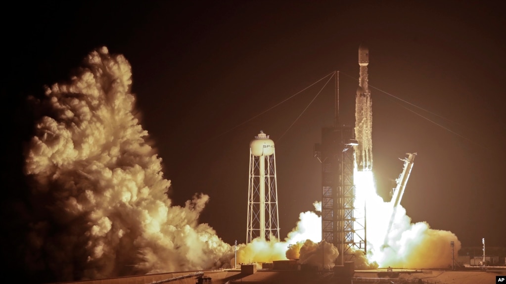 A SpaceX Falcon heavy rocket lifts off from pad 39A at the Kennedy Space Center in Cape Canaveral, Fla., early Tuesday, June 25, 2019. (AP Photo/John Raoux)