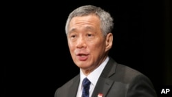 FILE - Singapore Prime Minister Lee Hsien Loong delivers a keynote speech at the 20th International Conference on The Future of Asia in Tokyo, May 22, 2014.