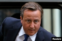 Britain's Prime Minister David Cameron arrives at Number 10 Downing Street in London, Aug. 27, 2013.