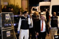Turkish police officers arrive at the Saudi Arabia's Consulate in Istanbul, Oct. 15, 2018.