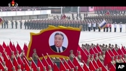 In this image made from video broadcast by North Korean broadcaster KRT, a portrait of the country's founder, Kim Il Sung, is carried during a parade at Kim Il Sung Square in Pyongyang, April 15, 2017.