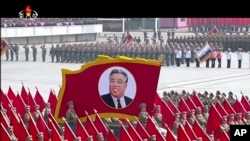 In this image made from video broadcast by North Korean broadcaster KRT, a portrait of the country's founder, Kim Il Sung, is carried during a parade at Kim Il Sung Square in Pyongyang, April 15, 2017.