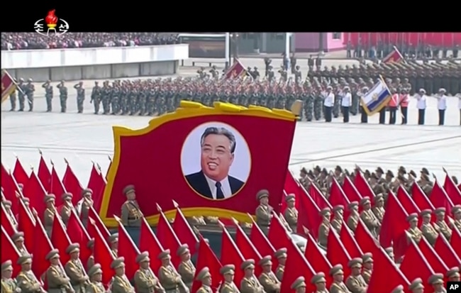 In this image made from video broadcast by North Korean broadcaster KRT, a portrait of the country's founder, Kim Il Sung, is carried during a parade at Kim Il Sung Square in Pyongyang, April 15, 2017.