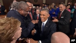 President Barack Obama greets lawmakers ahead of his State of the Union address to a joint session of Congress on Capitol Hill, Jan. 20, 2015, in Washington.