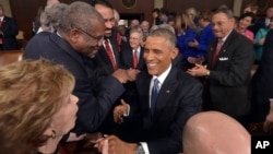 President Barack Obama greets lawmakers ahead of his State of the Union address to a joint session of Congress on Capitol Hill, Jan. 20, 2015, in Washington.