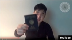 A man identified himself as Kim Han Sol shows his North Korean passport in a video posted by Cheollima Civil Defense. Kim said that he is the son of Kim Jong Nam, the half-brother of North Korean leader Kim Jong Un. (YouTube)