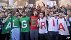 Algerians march during a protest in Algiers, Algeria, March 15, 2019.