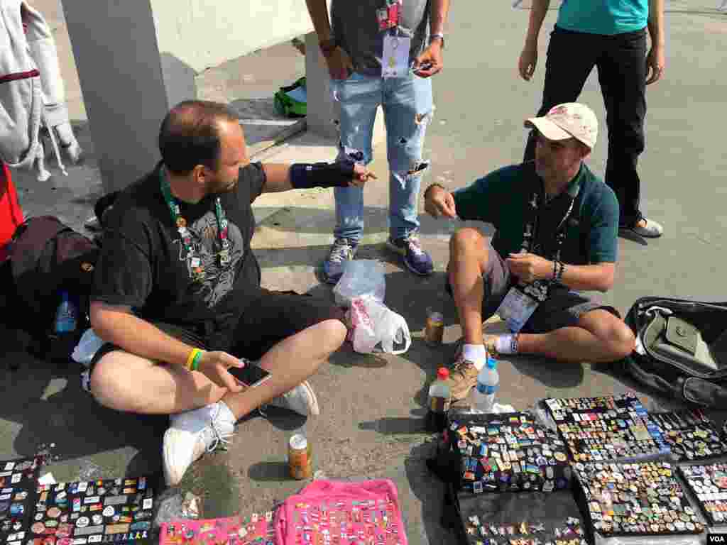 Vendors sell mementos from the Olympic Games in Rio de Janeiro, Brazil, Aug. 8, 2016. (P. Brewer/VOA)