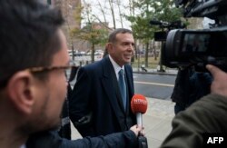 FILE - Former FIFA vice president Juan Angel Napout, center, of Paraguay arrives at Brooklyn Federal Courthouse in New York, Nov. 13, 2017.