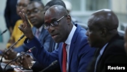 Haiti's Minister of Planning and External Cooperation Aviol Fleurant gestures as he speaks during a news conference about the resolution on the Oxfam scandal in Port-au-Prince, Haiti, June 13, 2018. 