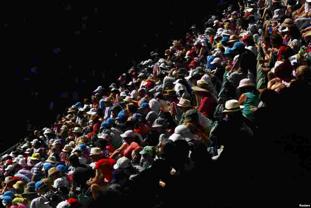 Fans watch the tennis action at Rod Laver Arena during the Australian Open tennis tournament in Melbourne, Australia.