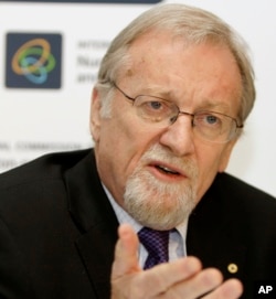FILE - In this Oct. 21, 2008, file photo, Gareth Evans, former Australian Foreign Minister, speaks to reporters in Sydney.
