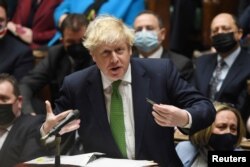 British Prime Minister Boris Johnson speaks during the weekly question time debate at Parliament in London, Britain, Jan. 19, 2022.