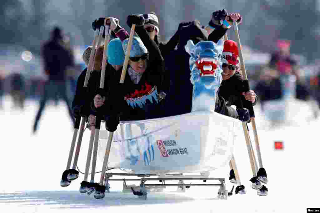 Participants compete during the Ice Dragon Boat Festival on Dows Lake in Ottawa, Ontario, Canada, Feb. 18, 2017.