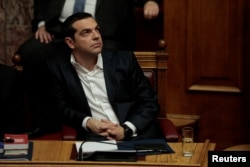 FILE - Greek Prime Minister Alexis Tsipras attends a parliamentary session in Athens.