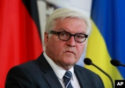 FILE - German Foreign Minister Frank-Walter Steinmeier says the Russian travel ban on EU officials works against efforts "to persistent and dangerous conflict in the middle of Europe."