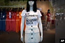A mannequin showcases a clothing by Forever 21, an American fast fashion retailer that is offering clearance discounts after it pulled out from China's market, at a shopping mall in Beijing, May 7, 2019.