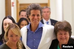 Bill Cosby accuser Andrea Constand, center, reacts after the guilty on all counts verdict was delivered in the sexual assault retrial at the Montgomery County Courthouse in Norristown, Pennsylvania, April 26, 2018.