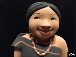 A closer look at one of Kathleen Wall's ceramic dolls. (J.Taboh/VOA)