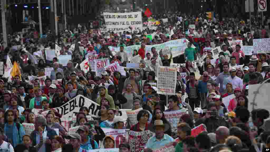 Tens of thousands of demonstrators march in protest for the disappearance of 43 students in the state of Guerrero, in Mexico City, Nov. 5, 2014. 