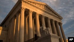  FILE - The Supreme Court in Washington, at sunset, Oct. 10, 2017. The Supreme Court is making new legal filings available online starting Monday, years behind the rest of the federal court system.