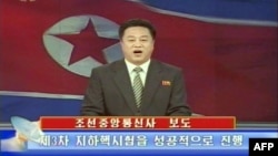 North Korean TV on Feb. 12, 2013 shows an announcer reading a statement on the country's nuclear test. (North Korean TV)