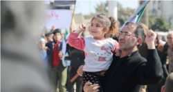 Anwar Alyousef and his daughter Tala, 4, at the protest on Feb. 26, 2021 in Idlib, Syria. (Mohammad Daboul/VOA)