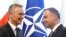 NATO Secretary General Jens Stoltenberg (L) shakes hands with Polish President Andrzej Duda prior to talks in Warsaw, Poland, May 28, 2018.