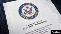 The 300-page Trump-Ukraine Impeachment Inquiry Report is seen after being released by the U.S. House Intelligence Committee in Washington, Dec. 3, 2019. 