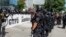 Portland police keep Patriot Prayer affiliates separate from antifa protesters during a rally in Portland, Ore., Saturday, Aug. 4, 2018.Small scuffles broke out Saturday as police in Portland, Oregon, deployed "flash bang" devices and other means to disperse hundreds of right-wing and self-described anti-fascist protesters.