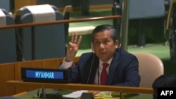 This screengrab of handout video made available on the U.N. YouTube channel shows Myanmar's ambassador Kyaw Moe Tun making a three-finger salute as he addresses the General Assembly on Feb. 26, 2021 in New York.