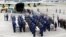 Military personnel unload a coffin with the remains of Brazilian victims who died in a plane crash in the Colombian jungle with Brazilian soccer team Chapecoense. The bodies will be flown home to Brazil, Dec. 2, 2016.