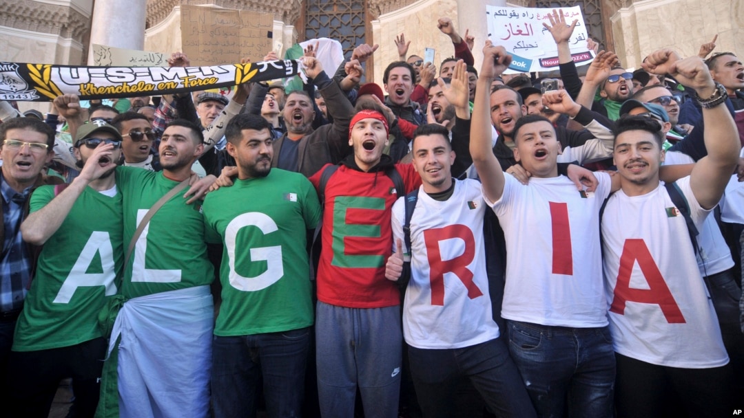 Algerians march during a protest in Algiers, Algeria, March 15, 2019.
