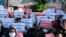 Protesters hold posters in support of the National Unity Government (NUG) during a demonstration against the military coup on Global Myanmar Spring Revolution Day in Taunggyi, Myanmar, on May 2, 2021. 