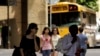 FILE - Students walk across a campus in Portland, Oregon.