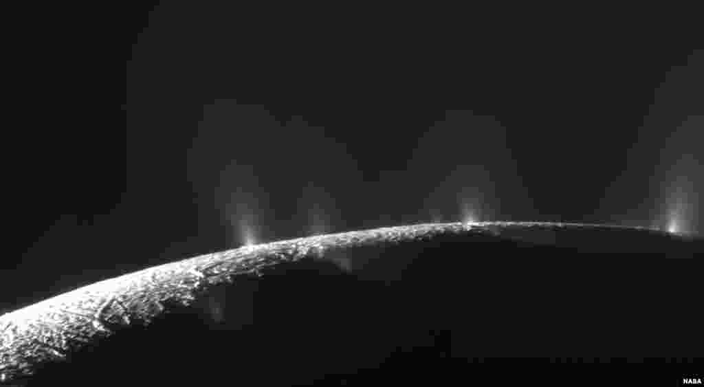 This Feb. 17, 2005 image made available by NASA shows plumes of water ice and vapor from the south polar region of Saturn&#39;s moon Enceladus. The activity is understood to originate from the moon&#39;s subsurface ocean of salty liquid water, which is venting into space.