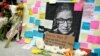 FILE - A memorial to U.S. Supreme Court Justice Ruth Bader Ginsburg includes a photograph of the late Justice, Sept. 22, 2020, outside the Harvard Law School library at Langdell Hall, on the campus of Harvard University, in Cambridge, Mass. 