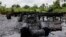 FILE- An abandoned illegal refinery is seen after it was raided by the Nigeria navy at the creeks of Bayelsa, Nigeria, May 18, 2013. At the time, the navy said it had destroyed 260 illegal refineries and burned 100,000 tons of contraband fuel to try to halt oil thefts bedeviling the economy of Africa's biggest petroleum producer.