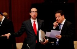 U.S. Treasury Secretary Steven Mnuchin talks with a delegate during the G20 finance ministers and central bank governors meeting in Fukuoka, Japan, June 8, 2019.