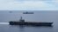 Hai tàu sân bay Mỹ USS Ronald Reagan (trước) và USS Nimitz (sau) đi cùng nhau ở Biển Đông hồi tháng 7/2020 (ảnh tư liệu).